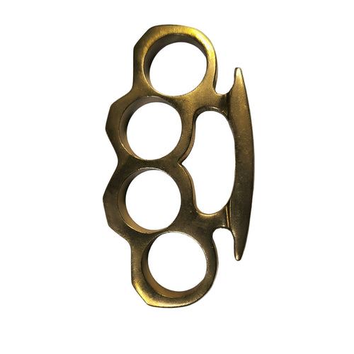 Brass knuckles with a blade on a gray background